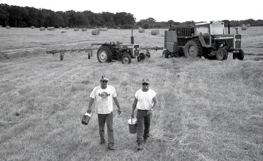 Mr. Holland and company out on the hay meadow -- a hundred acre sea of lush Bermuda on Daphne Prairie.