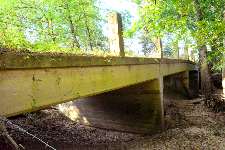 An original bridge on the Bankhead Highway, the first paved road across America, spans Evans Creek on the Hess Ranch. Evans Creek was named for John Evans, Junior who came from Tennessee and arrived here in 1846, the year Titus County was formed. Mr. Evans was elected as a Titus County commissioner.