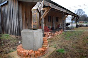 After contractors completed the second exhibit building at DeKalb's museum, Mr. McCrary began work on a cistern system including water-tight cypress-wood gutters.
