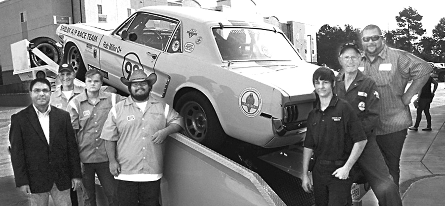 At
left in the photo above, NTCC’s Dr. Kevin Rose and driver Rob Miller pose with members of the class that worked
a year re-creating a 50-year-old Mustang.
