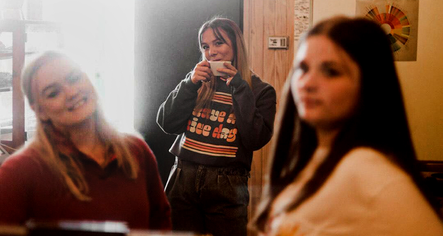 Tabatha Lyon is framed by Baley O’Neal on the left and Emilee Miles